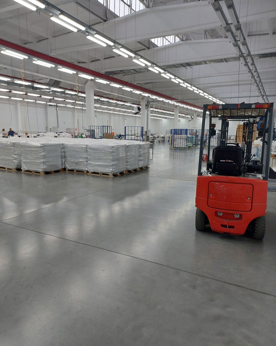 Forklift and palletised cargo in a warehouse